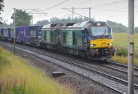 DRS 68004 and 68017 with the Tesco Daventry - Mossend service at Fiddlers Gill, south of Braidwood.<br><br>[Bill Roberton 12/08/2016]