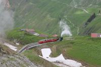 RB No.12, waiting in Oberstafel loop to climb the final section to the Rothorn summit, is seen from a descending train on 20th June 2016. Only an hour before as we went up the mountain this spot had been completely in dense cloud.<br><br>[Mark Bartlett 20/06/2016]