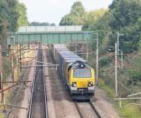Freightliner 70005 and the Coatbridge to Daventry containers head south at Barton & Broughton on the August Bank Holiday, 2016. This image taken from the bridge that carries the <I>Guild Wheel</I> over the WCML. The Guild Wheel is a 21 mile circular cycle route around the City of Preston. Its other WCML crossing is under the Ribble Viaduct immediately south of Preston Station.  <br><br>[Mark Bartlett 29/08/2016]