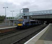 An Inverness to Glasgow service departs Perth with a honk  for trackworkers ahead. This view gives a rather misleading picture of the station which in the main is unreconstructed Victorian (and all the better for it).<br><br>[David Panton 05/10/2016]