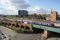 With Salford Central to the right and behind the camera, a Northern Class 319 from Manchester Victoria to Liverpool service takes the line towards Ordsall Jct on 08 October 2016. The lines to the right head towards Salford Crescent.<br><br>[John McIntyre 08/10/2016]