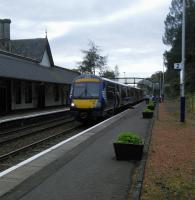 Loop Platform 2 at Dunkeld is used only to allow passing, as here when a Glasgow to Inverness service waits an Edinburgh-bound to arrive and allow it to proceed.<br><br>[David Panton 05/10/2016]