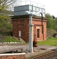 The water tower and crane at the south end of Appleby station, photographed on 6 May 2006. The facilities were installed by the local Round Table in 1991 to service the increasing number of steam specials using the Settle & Carlisle route.<br><br>[John Furnevel 06/05/2006]
