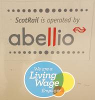 In March, Abellio ScotRail became the sixth largest living wage employer, entitling use of the logo seen here as a door decal.<br><br>[John Yellowlees 01/11/2016]