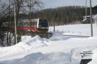 A Class 92 DMU of the Norwegian State Railways NSB comes into view on its way east. It was known as Nabotåget, the neighbour train and it ran from a suburb of Trondheim to Östersund Central. As the line had been closed at Stora Helvetet (a very steep-sided embankment which was showing signs of instabilty) from November 2013 to early 2015 the service was suspended and with tendering of rail services it looks unlikely to be restored when that part of the line is replaced by a bridge in 2018. It is only due to run from Storlien just on the Swedish side of the border to and from Trondheim.<br><br>[Charlie Niven 04/04/2013]
