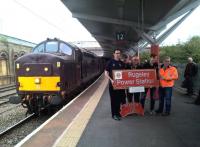 I wonder where they've been? Passengers on the 'Cliffe Hopper' railtour [see image 57204] pose with a nameplate which they just won in a charity auction. The locomotive is 37.668.<br><br>[Ken Strachan 07/10/2016]
