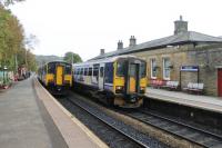 With the chord to the Copy Pit line reinstated Todmorden now sees four trains an hour in each direction. Three of these go to Leeds by either Bradford or Dewsbury and the fourth runs to Burnley and Blackburn. 150218 and 155347 call at the station on 21st October 2016.   <br><br>[Mark Bartlett 21/10/2016]