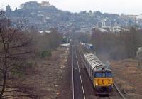 The stock of the Caledonian Sleeper led by Class 73/9 and Class 66 locos heads south out of Stirling past the site of the former Polmaise colliery sidings on 18th February 2017. The train was en route from Aberdeen to Polmadie Carriage Maintenance Depot.<br><br>[Mark Dufton 18/02/2017]