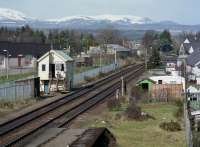 Looking from Muir of Ord station to the closed North Signal Box. Only the extra disused platform face betrays that the there was once a yard here and the Fortrose branch curved off to the right.<br><br>[Bill Roberton //1988]