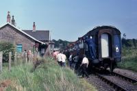 A shot of the last train to Forfar taken on 5.6.82 showing passengers disembarking at Burrelton. Track-lifting commenced the following Autumn.<br><br>[Graeme Blair 05/06/1982]