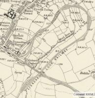 Extract from a 6 inch map from around 1913 showing the curious (unique?) arrangement at Liskeard. In railway terms the scene is little changed today with Looe branch trains departing from the separate station at right angles to the main platforms then dropping down through a 180 degree curve to pass under the main line via Liskeard viaduct [See image 29447]. There are a number of photographs of Liskeard and the Looe line on Railscot.<br><br>[Mark Bartlett //1913]