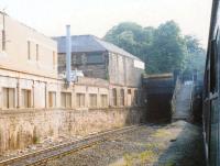 The former station at Newington viewed from a diverted Edinburgh to Birmingham train in 1989. Is that a small Buddleia just visible on the far side of the steps? Apart from that the area was fairly free of vegetation. For comparison [see image 54972].<br><br>[Charlie Niven /07/1989]