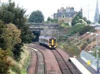 A morning service from Newcraighall has just left Brunstane on 15 October 2002. ScotRail 158717 is about to pass below Milton Road before joining the ECML for the run to Waverley.<br><br>[John Furnevel 15/10/2002]
