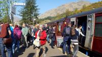 Having drawn forward to allow a ScotRail service to pass, passengers are allowed to stretch their legs at Glenfinnan. The train has its own Souvenir Shop. The station enjoys a burst of activity unrivalled the rest of the day.<br><br>[Beth Crawford 02/05/2017]