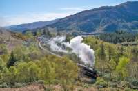 45407 heads west, winding its way out from Glenfinnan station with <i>The Jacobite</i>. Loch Shiel is in the background right.<br><br>[Ewan Crawford 04/05/2017]