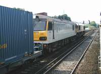 Looking back from a London bound commuter service calling at Redhill on 13 July 2002 as a lengthy train of containers runs south through the station on the centre road. Locomotives 66007 and 92008 <I>Jules Verne</I> are at the head of the train, which is signalled for the Channel Tunnel route via Ashford.<br><br>[Ian Dinmore 13/07/2002]