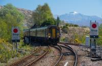 Mallaig bound Sprinter entering Glenfinnan. Guards on the West Highland are often a breed apart and the guard on this train was no exception. Guard, tour guide, entertainer; all handled with good grace.<br><br>[Ewan Crawford 03/05/2017]