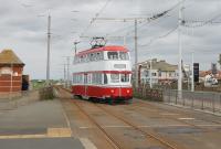 Balloon 701, in eye catching red and white livery, uses the crossover at Cabin to regain the southbound line after an Easter weekend heritage trip from Pleasure Beach. The current paint scheme is certainly an improvement on that previously carried [See image 42861].<br><br>[Mark Bartlett 17/04/2017]