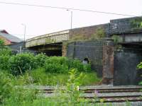 This is the site of Golborne South station, on the WCML which closed in 1961. The old ticket office was in the bricked up section of the bridge above the pier and the station footbridge (the lattice structure crossing the slow lines) has been modified post electrification and recommissioned to carry the southerly footpath of the A573.<br>
<br><br>[Michael Butterworth 16/06/2017]