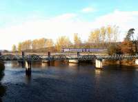 The early morning train for Inverness off the Far North Line  crossing the river at Conon Bridge on 23 November 2003 on the way to its next stop at Muir of Ord.<br><br>[John Furnevel 23/11/2003]