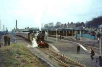 NBR 256 Glen Douglas after arrival at Dunfermline (Lower) from Waverley on 30 March 1964 with <I>Scottish Rambler No 3</I>. From here, the train will travel back to Charlestown Junction, then along the north shore of the Forth via Kincardine to Alloa.<br><br>[John Robin 30/03/1964]