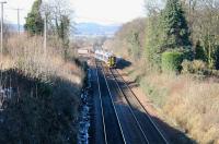 With traces of snow still visible, a train comes off the Bathgate branch at Newbridge Junction on 12 March 2006 with a service to Newcraighall.<br><br>[John Furnevel 12/03/2006]