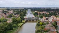 The 1215hrs Skegness to Nottingham service crosses the River Witham as it arrives in Boston on 14th July 2017. This view looks North West along the river from the tower of St Botolph's church (The Boston Stump)<br>
<br><br>[David Prescott 14/07/2017]