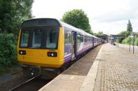 A Colne to Blackpool South service calls at Mill Hill on 03 June 2017. Although the train has 4 carriages (a Class 150 and 142) the rear unit is locked out of service as far as Preston due to platform length at some stations on the line.<br><br>[John McIntyre 03/06/2017]