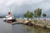 Paddle Steamer <I>Maid of the Loch</I>, still berthed alongside Balloch Pier in August 2017and acting as a cafe while awaiting operational restoration. The station finally closed in 1986 but the line of the old platform, minus its canopy, is shown by the white railings. <br><br>[Mark Bartlett 01/08/2017]