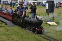 A minature locomotive, loosely modelled on an LNER V2 2-6-2 with a Group Standard tender, giving rides with a rake of suburban coaches at the Gloucestershire Vintage and Country Show, South Cerney Airfield on 6th Augst 2017.<br>
<br><br>[Peter Todd 06/08/2017]