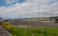 Looking over the site of Winton Pier station towards the buffers. The wall in the foreground was the wall on the west side of the station, now the back wall of the covered walking way from Ardrossan Harbour to the CalMac terminal.<br><br>[Ewan Crawford 10/08/2017]
