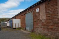 The reverse (non station) side of the former goods shed at Ardrossan Town, now given over to other uses. In the background on Castlehill is the MacFadzean Memorial.<br><br>[Ewan Crawford 10/08/2017]