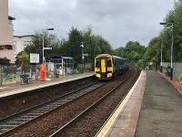 The 0939 Anniesland service departs from the very well tended Summerston station at the end of August 2017. A fine selection of plants adorns the platforms.<br><br>[Colin McDonald 29/08/2017]