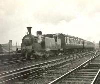 Caledonian 0-4-4T  55219 at Port Eglinton Junction on 25 April 1959 with a train of empty stock for St Enoch. [Ref query 1677] 