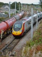 The 10.51 Edinburgh - Euston joins the WCML at Carstairs South Junction, passing 70804 heading north with the Dalston - Grangemouth empty tanks. 3rd October 2017.<br>
<br>
<br><br>[Bill Roberton 03/10/2017]