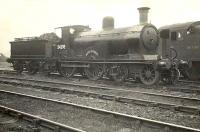Built by Dubs & Co in 1898, Drummond <I>'Small Ben'</I> 4-4-0 no 54398 <I>Ben Alder</I>, stands on shed at St Rollox in November 1950. The historic ex-Highland Railway locomotive, the last of its class, was stored  for some time following withdrawal with a view to preservation. Sadly this was not to be. [See image 36646] <br><br>[G H Robin collection by courtesy of the Mitchell Library, Glasgow 01/11/1950]