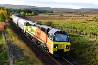 Colas Rail liveried 70814 climbs the gradient out of Tomatin with thirteen Tarmac cement tankers for Inverness. 12th October 2017.<br>
<br>
<br><br>[John Gray 12/10/2017]