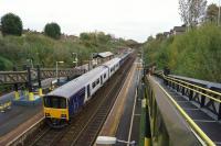 With the rebuilding of Liverpool Lime Street, trains from Manchester Oxford Road via Warrington were terminating at Hunts Cross on 20 October 2017. The third rail beneath the Class 150 is for Merseyrail services as is the other side of the island platform. This is the southern limit of Merseyrail services. This view is from the station footbridge looking east.<br><br>[John McIntyre 20/10/2017]