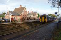 A Manchester to Liverpool via Warrington service calls at Irlam on 20 October 2017. The old station building has been renovated and now houses a small museum as well as the 'Café Bar 1923'. Further museum exhibits are situated in the garden area on the left.<br>
<br>
For a view of the station some 8 years ago before the changes [see image 25521]<br>
<br><br>[John McIntyre 20/10/2017]