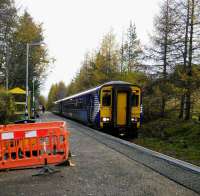 An Oban service calls at Tyndrum Lower on 1st November 2017. It's running late because of a delayed Up service and will in turn delay the next Up train here, then the one it joins at Crianlarich. Single lines, eh? Departure screens are being installed on the WHL, hence the ugly barriers.<br>
<br>
<br><br>[David Panton 01/11/2017]