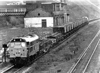 31236 heads east through Normanton with a mixed freight on 5th December 1980. At this time, although open, the station had a derelict feel about it but it survives today and has been tidied up a little [See image 40107]. The Brush Type 2 depicted in this unfortunately grainy photo was fitted with ETH four years later and renumbered 31433. It was eventually withdrawn (as 31533) in 1995. <br><br>[Mark Bartlett 05/12/1980]