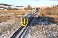 ScotRail 158782, forming the 1259 Tweedbank - Edinburgh, about to run through the site of Heriot station on 27 December 2017. Signs of the previous days snowfall are still very much in evidence.<br><br>[John Furnevel 27/12/2017]