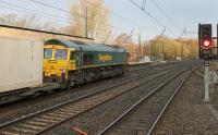 Freightliner 66551 rolls a Daventry to Mossend intermodal service through the Down Fast line at Lancaster station on 13th November 2017. <br><br>[Mark Bartlett 13/11/2017]