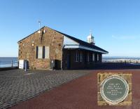 The old Morecambe Harbour station still stands on the Stone Jetty. In summer months it is a popular café but was closed on this sunny January afternoon when the Furness coastline and Cumbrian mountains were clearly visible from the jetty. A heritage plaque identifies the historic nature of the building. <br><br>[Mark Bartlett 07/01/2018]