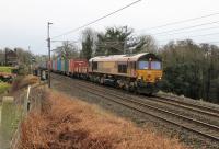 An MOD train ran to Glen Douglas from Fenny Compton on 24th January 2018. Grubby DB 66099 is seen passing Bay Horse with the short train of containers.<br><br>[Mark Bartlett 24/01/2018]