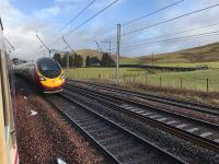 The tail end of a Virgin Pendolino disappears north (photographed from a much delayed Caledonian Sleeper waiting for it to pass in the loop at the former Abington station). <br><br>[Colin McDonald 10/02/2018]