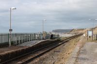 Nethertown station was a passing loop until the 1970s but only one platform is in use now. This remote but atmospheric halt on the Cumbrian Coast sees four 'on request' services each way on weekdays. This was the scene on a sunny 8th March 2018, looking towards St Bees Head, with two passengers waiting for the train. <br><br>[Mark Bartlett 08/03/2018]