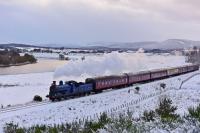 It is mid afternoon on 11th December 2017 and already the light is going as Caledonian Railway 0-6-0 No.828 approaches Broomhill with the second Santa Express of the day. In the background snow clouds gather and, on the left, light reflects off the River Spey.<br><br>[John Gray 11/12/2017]