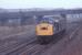 An unidentified Class 40 runs light engine through Whifflet North Junction around 1980. At this time R. B. Tennants were still in full production at the Meadow Works in the to right background. The old Airdrie line to Imperial and Calder is on the left.<br>
<br>
<br><br>[Alastair McLellan //1980]