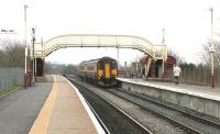 A Glasgow Central service arrives at Auchinleck station in March 2006.<br><br>[John Furnevel 13/03/2006]